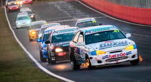 race cars driving at top speed at bathurst